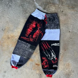 Spooky gothic jogger pants with horror character details, sustainable Halloween patchwork streetwear..