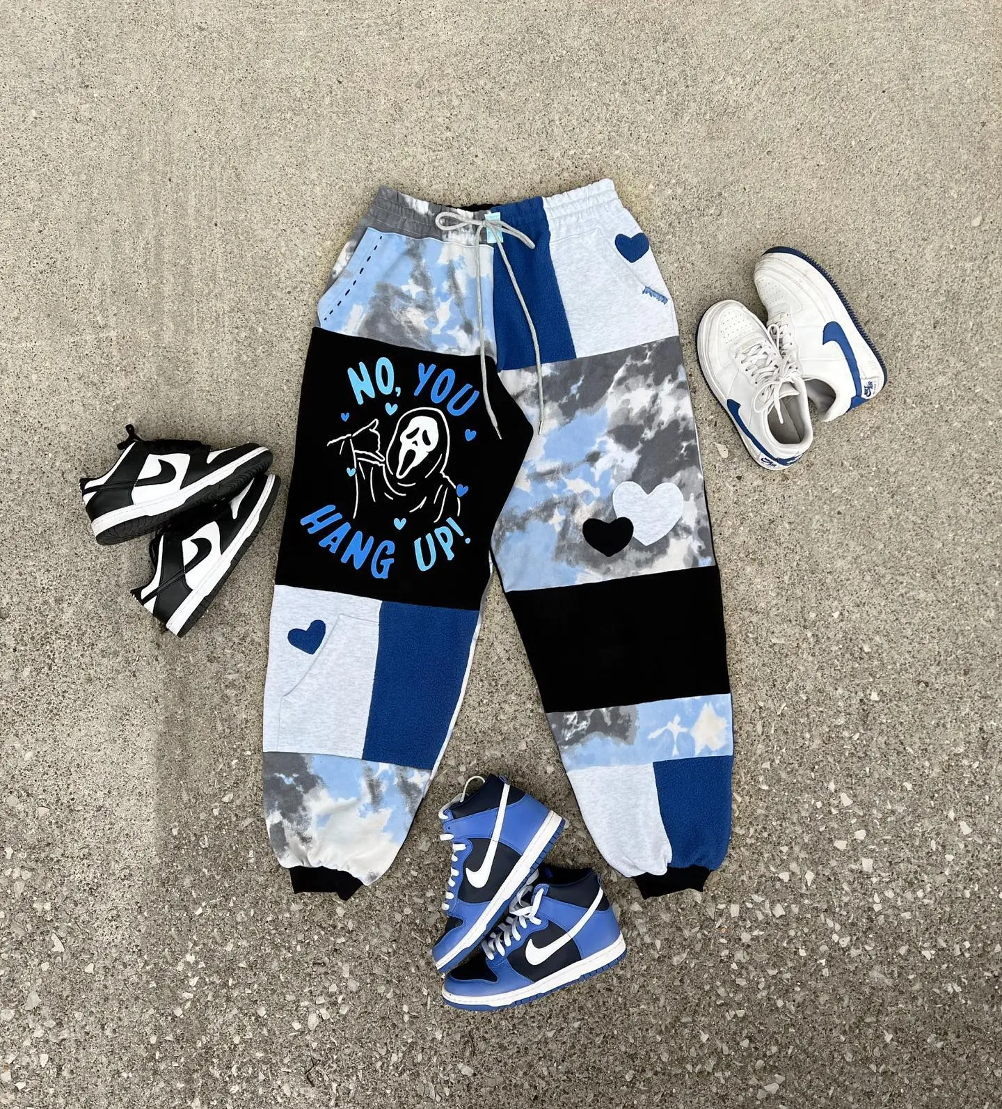 Eco-friendly vintage jogger pants with horror character Halloween designs, matching patchwork streetwear..