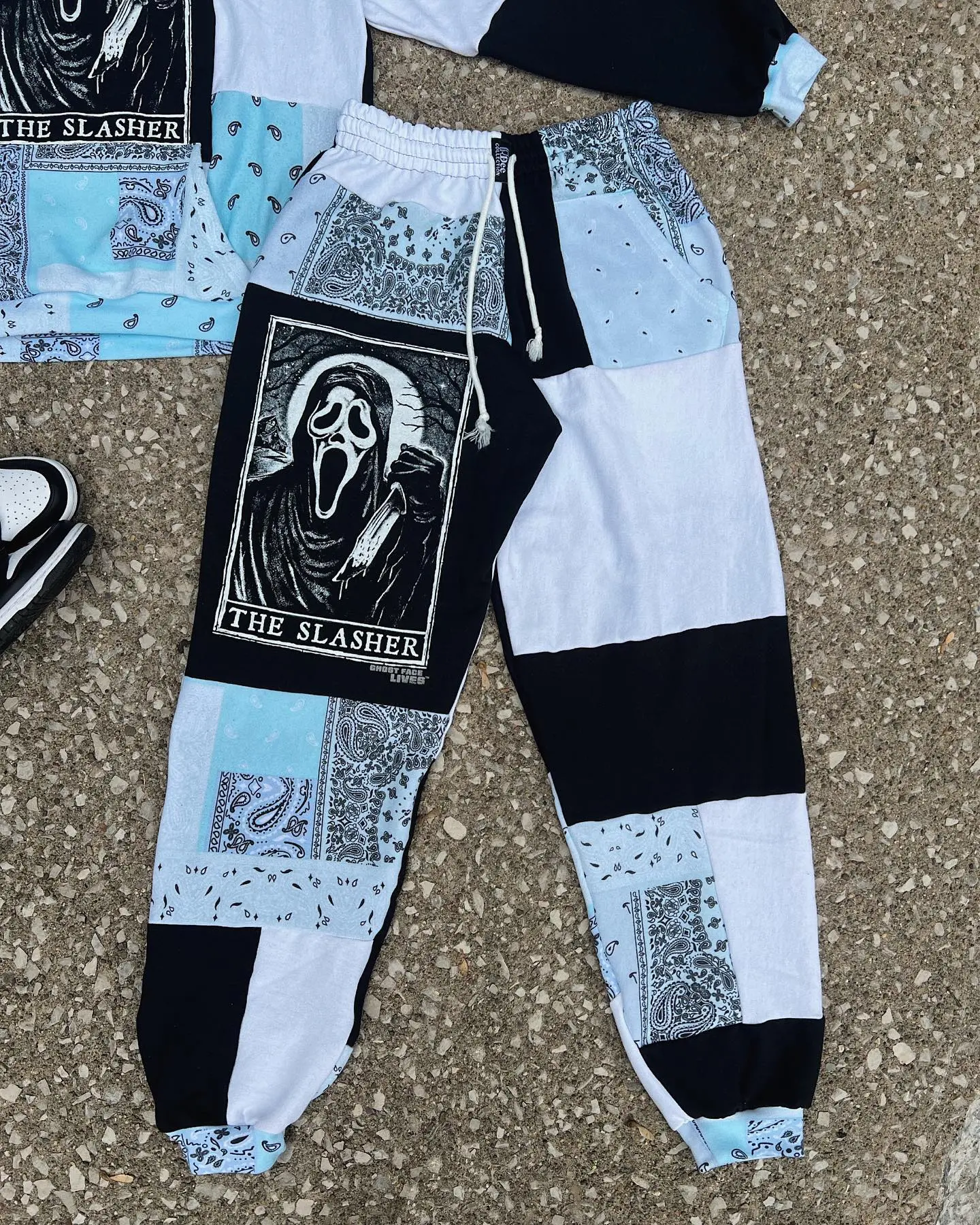 Matching patchwork jogger pants for couples, vintage Halloween streetwear with spooky eco-conscious design..